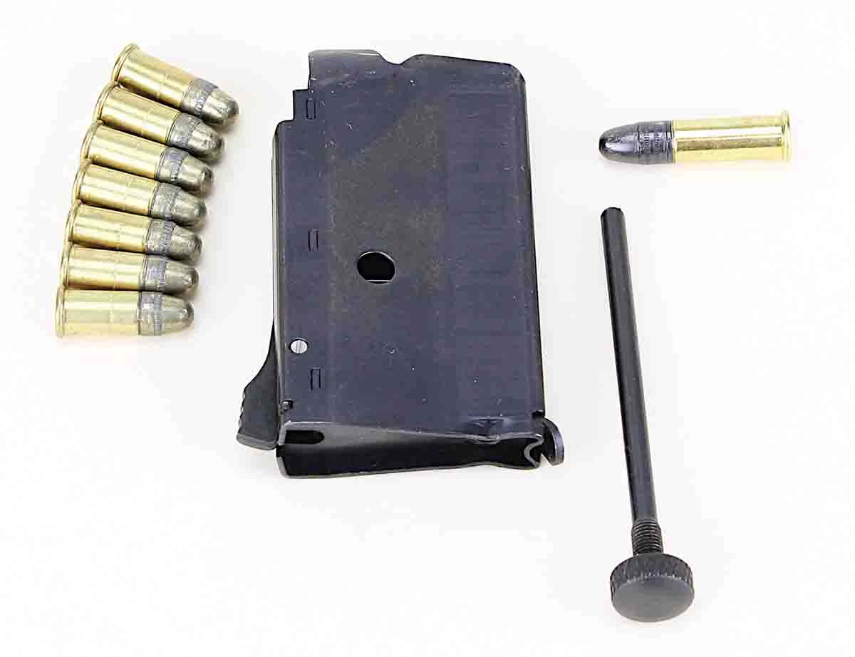 Removing the long screw from the magazine changes the rifle from a .22 LR single shot to a seven-shot repeater. Installed, the screw permits loading with .22 Shorts.